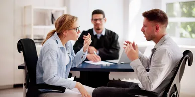 Small team in discussion around table